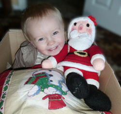 Little boy smiling in Christmas box
