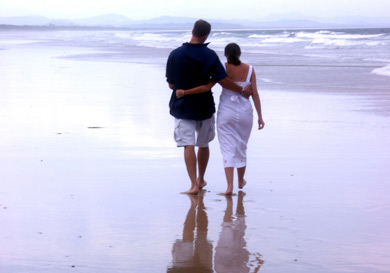 Man and woman walking together on Australian beach