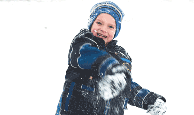 Boy throwing snowball