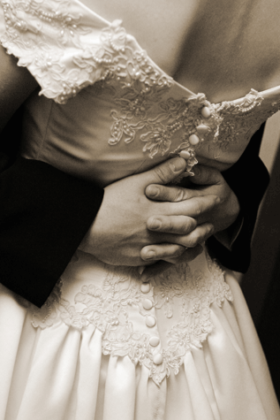 man and woman dancing close