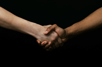 Black and White hands clasped