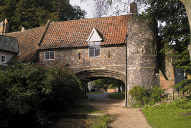 15th century house in Norfolk with tower and red tile roof