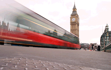 Bus rushes past Houses of Parliament