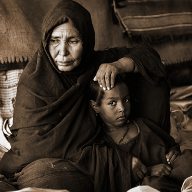 Poverty-stricken mother and child in Africa.  Africans lack property rights, honest governments, freedom for women