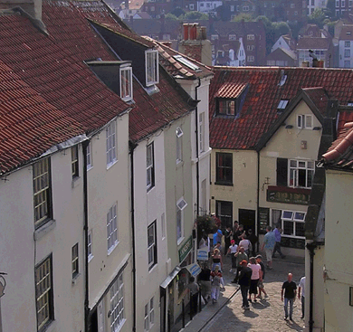 Small town of Whitby, England, full of people outside on a sunny day