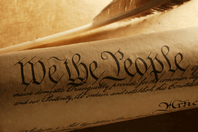 Image shows the first words of the U.S. Constitution – We the People