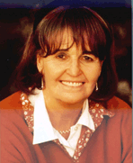 Close up of Baroness Cox, dark-haired and smiling slightly