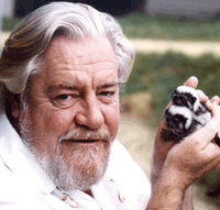 Gerald Durrell lovingly holds tiny monkeys
