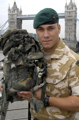 Lance Corporal Croucher and blown-up rucksack