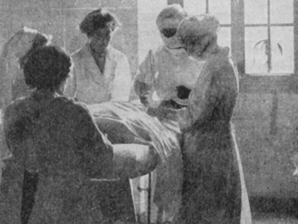 Women doctors and nurses operating on a patient during World War One