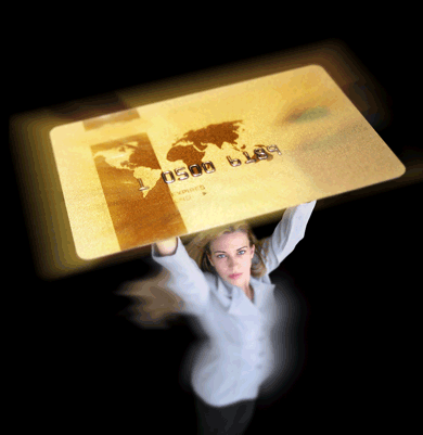 Woman holding huge credit card above her head