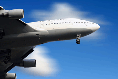 Big jet plane flying in very blue sky