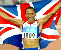 Kelly Holmes winning Olympics and carrying British flag
