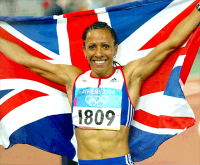 Kelly Holmes carrying the Union flag after winning gold at the 2004 Olympics