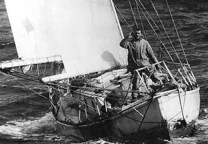 Knox-Johnston standing on his ketch in heavy seas